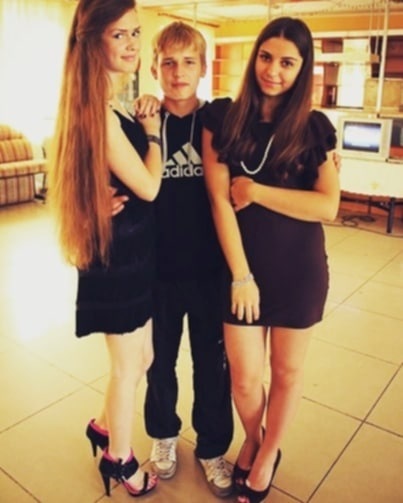Rostislav Kucheriavenko at school with female classmates 
